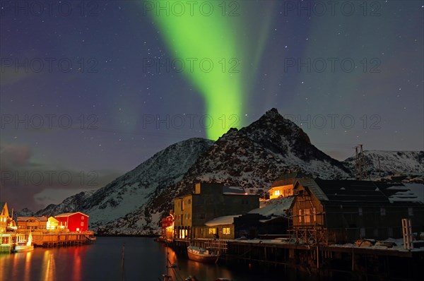 Small harbour with illuminated houses