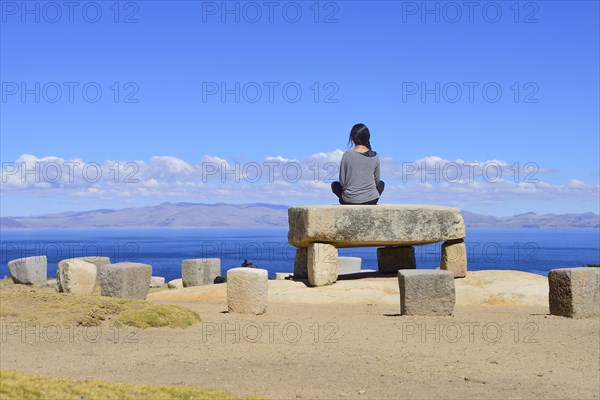 Woman sitting on the Roca Sagrada