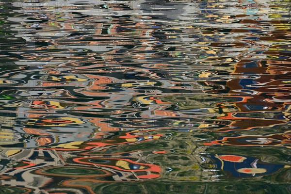 Colourful reflection on the water surface
