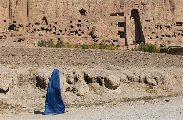 Woman in Burkha before the great buddhas in Bamyan