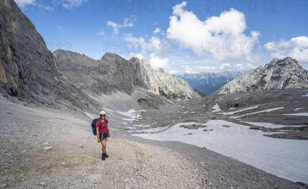 Hiker crossing a scree field