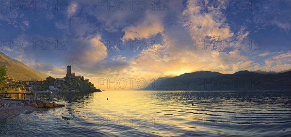 Historic coastal town of Malcesine with the Castello Scaligero castle at sunset