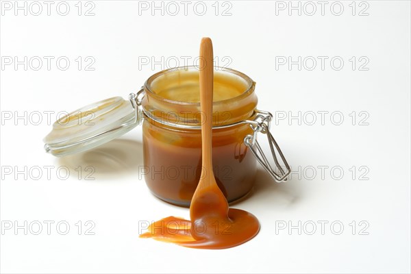 French caramel cream in glass with spoon