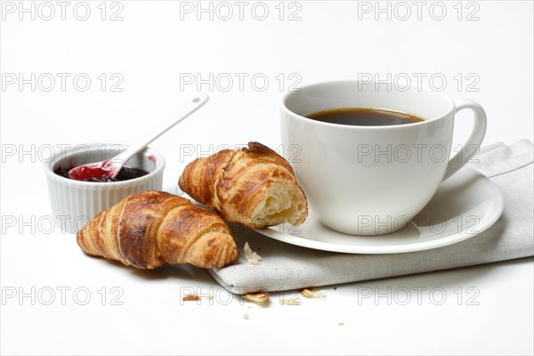 Two croissants with cup of coffee