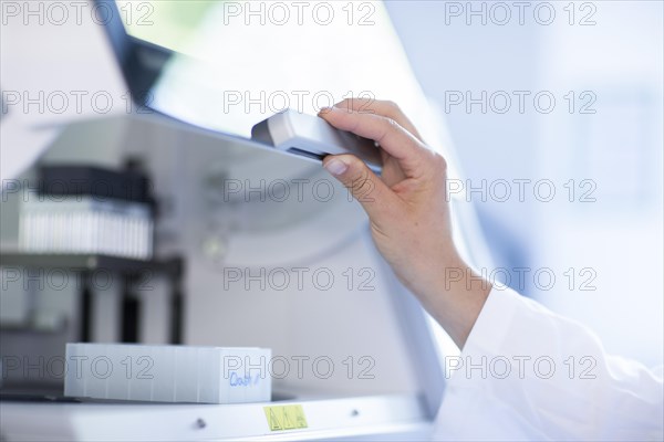 Multiple samples taken by a laboratory technician at a laboratory apparatus in the laboratory