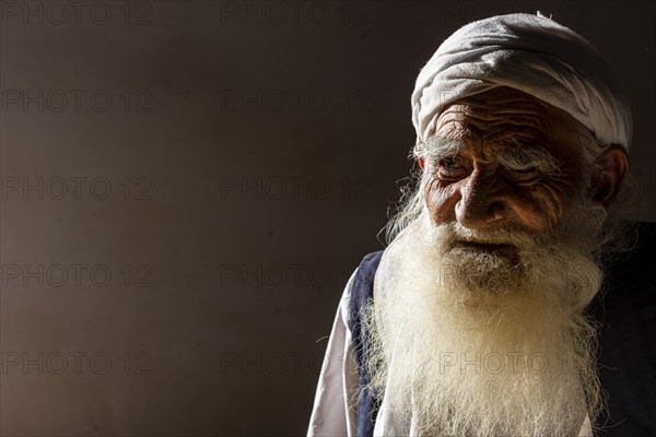 Sufi priest studying the holy Quran in the Shrine of Mawlana Abdur Rahman Jami