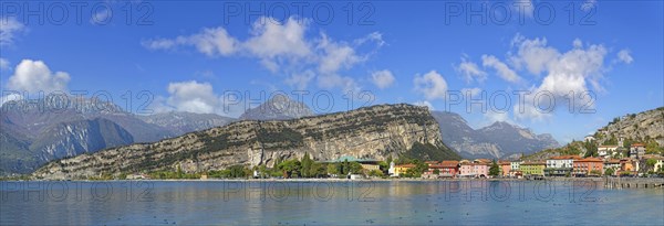 Coastal town panorama with colourful houses and the rocky mountain Monte Brione