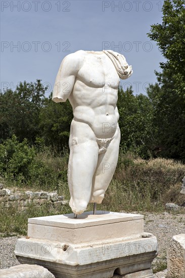 Collosal torso of a naked male god in the Hadrian's Bath of Aphrodisias in Aydin