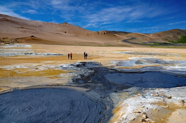 Hot mud springs bubbling in geothermal landscape with different colours