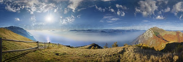 Mountain panorama with Lake Garda in the morning mist