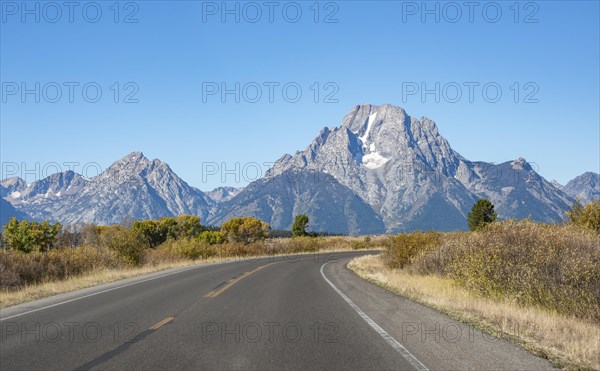 Country road through autumn landscape