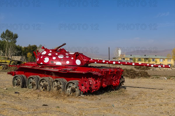 Old soviet tank coloured in funky colours