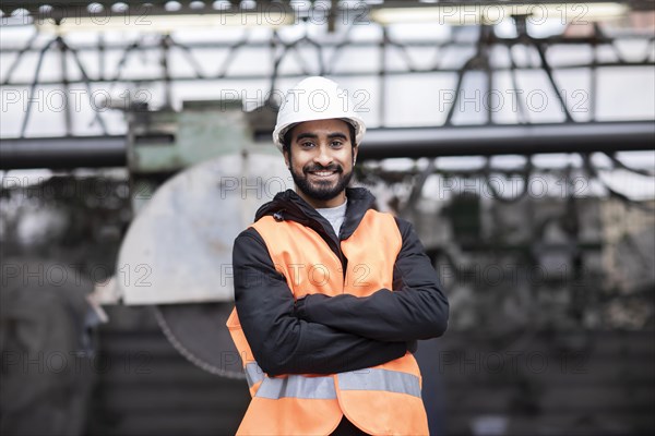 Technician with beard and helmet