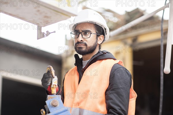 Technician with beard and helmet