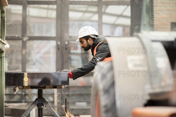 Technician with beard and helmet