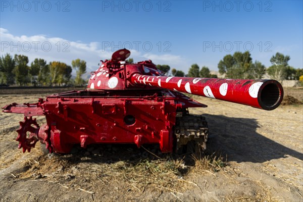 Old soviet tank coloured in funky colours