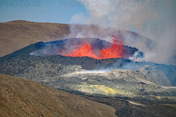 Lava fountains bubbling in a volcanic crater