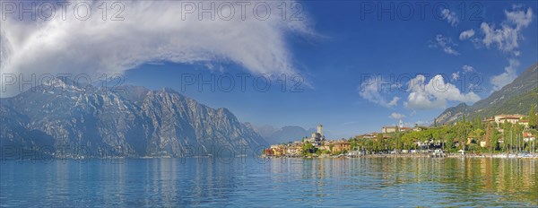 Historic coastal town of Malcesine with Castello Scaligero castle and bizarre cloudy sky