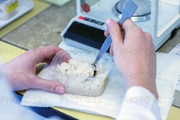 Laboratory assistant prepares sample in food control laboratory with Spartel