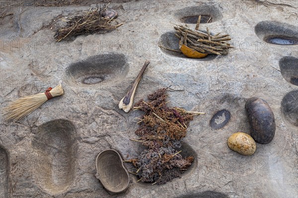 Rocks to grnid Sorghum from the Laarim tribe