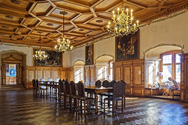 Dining room with wood panelling and coffered ceiling