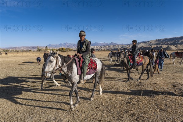 Men practising a traditional Buzkashi game