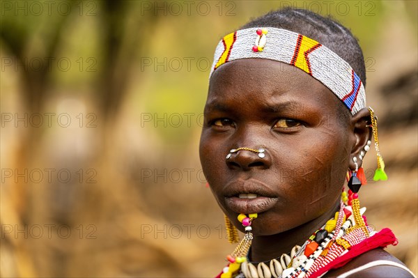 Traditional dressed young girl from the Laarim tribe