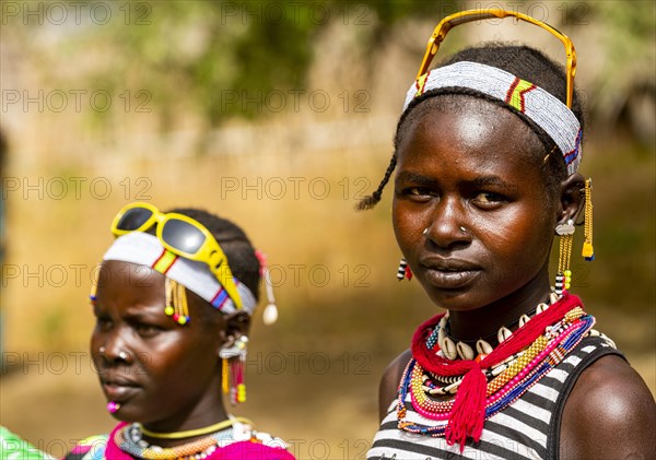 Traditional dressed young girls from the Laarim tribe