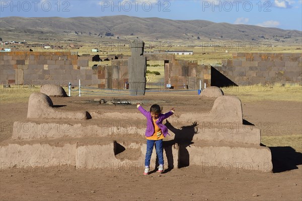 Little indigenous girl jumping from a platform