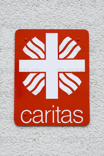 Sign and logo Caritas
