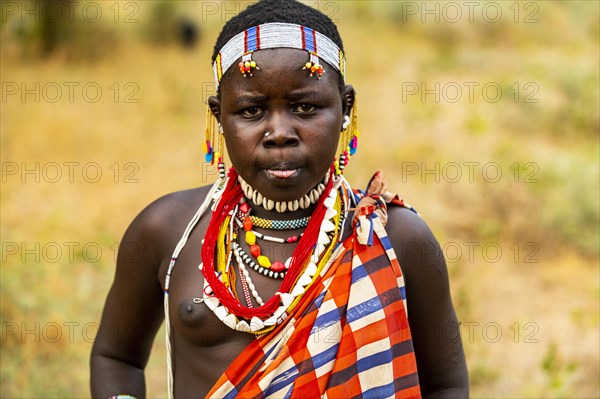 Traditional dressed young girl from the Laarim tribe