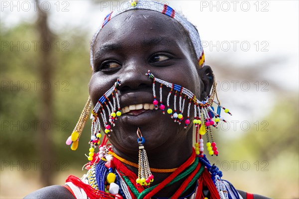 Traditional dressed young girl from the Laarim tribe