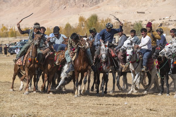 Men practising a traditional Buzkashi game