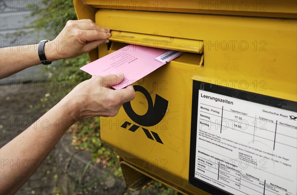 Election letter is put into Deutsche Post letterbox