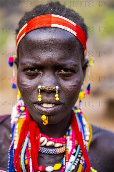 Traditional dressed young girl from the Laarim tribe