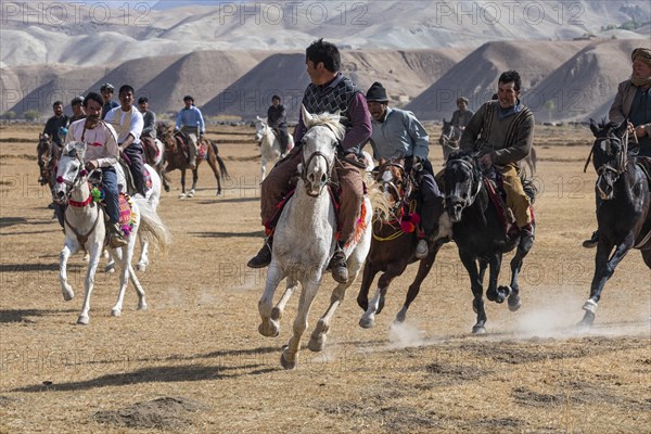 Men practising a traditional Buzkashi game