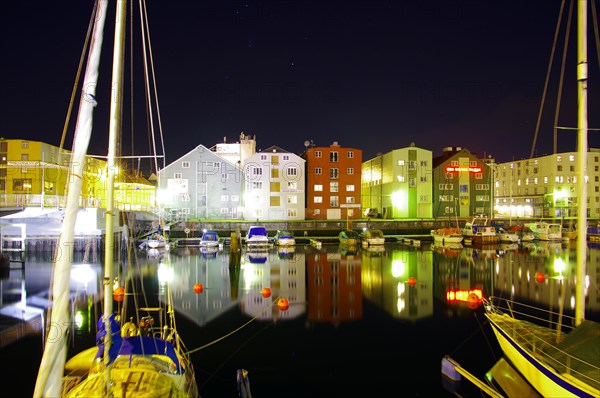 Sailboats and houses reflected in the water