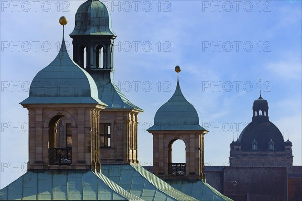 On the left towers and roof of the town hall