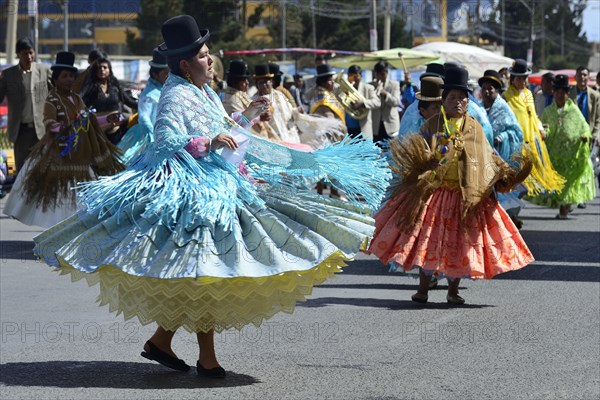 Dance group in traditional costumes at a parade