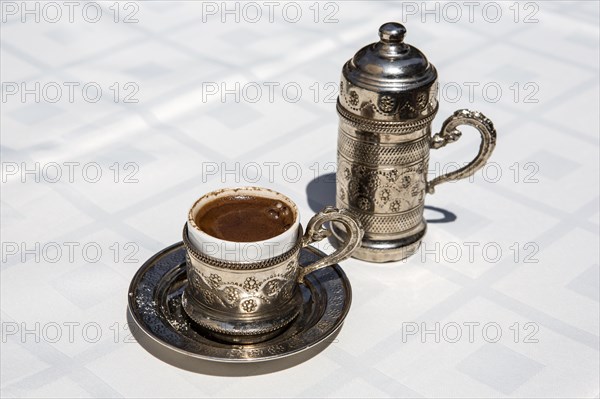 Cup of Turkish coffee with water