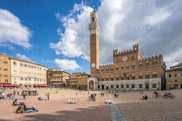 People in Piazza Il Campo with Palazzo Pubblico and Torre del Mangia