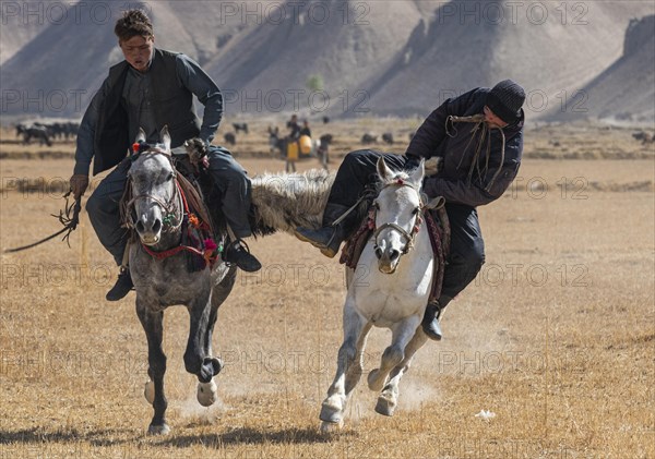 Men practising a traditional Buzkashi game