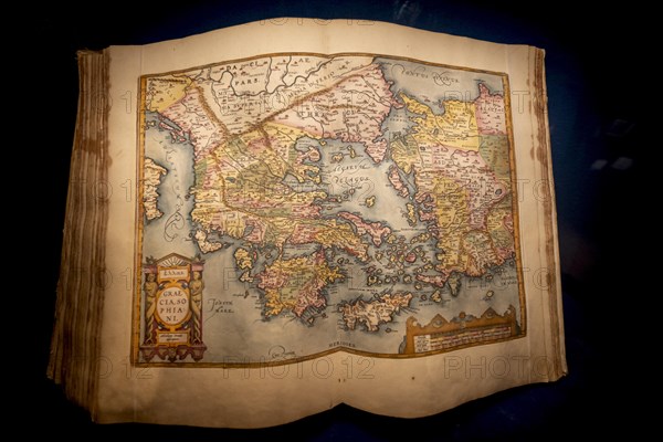 Antique book with an old map of Greece