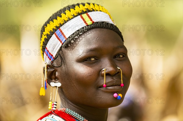 Traditional dressed young girl from the Laarim tribe