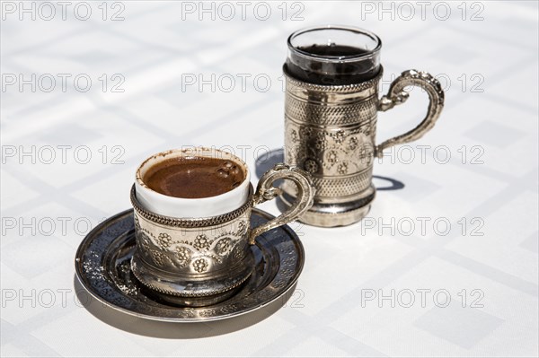 Cup of Turkish coffee with water