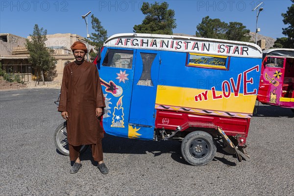 Man with his self styled rickshaw