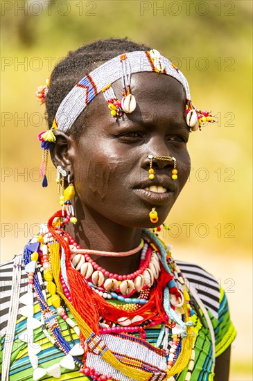 Traditional dressed young girl from the Laarim tribe