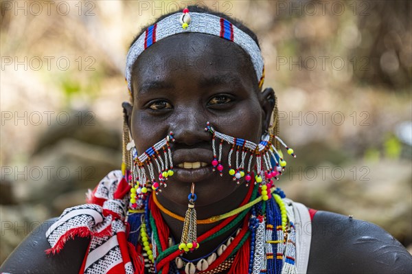 Traditional dressed young girl from the Laarim tribe