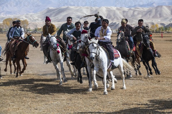 Men practising a traditional Buzkashi game