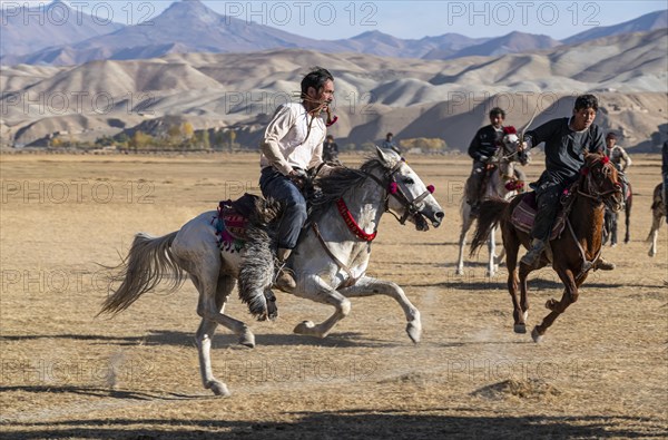 Men practising a traditional Buzkashi game